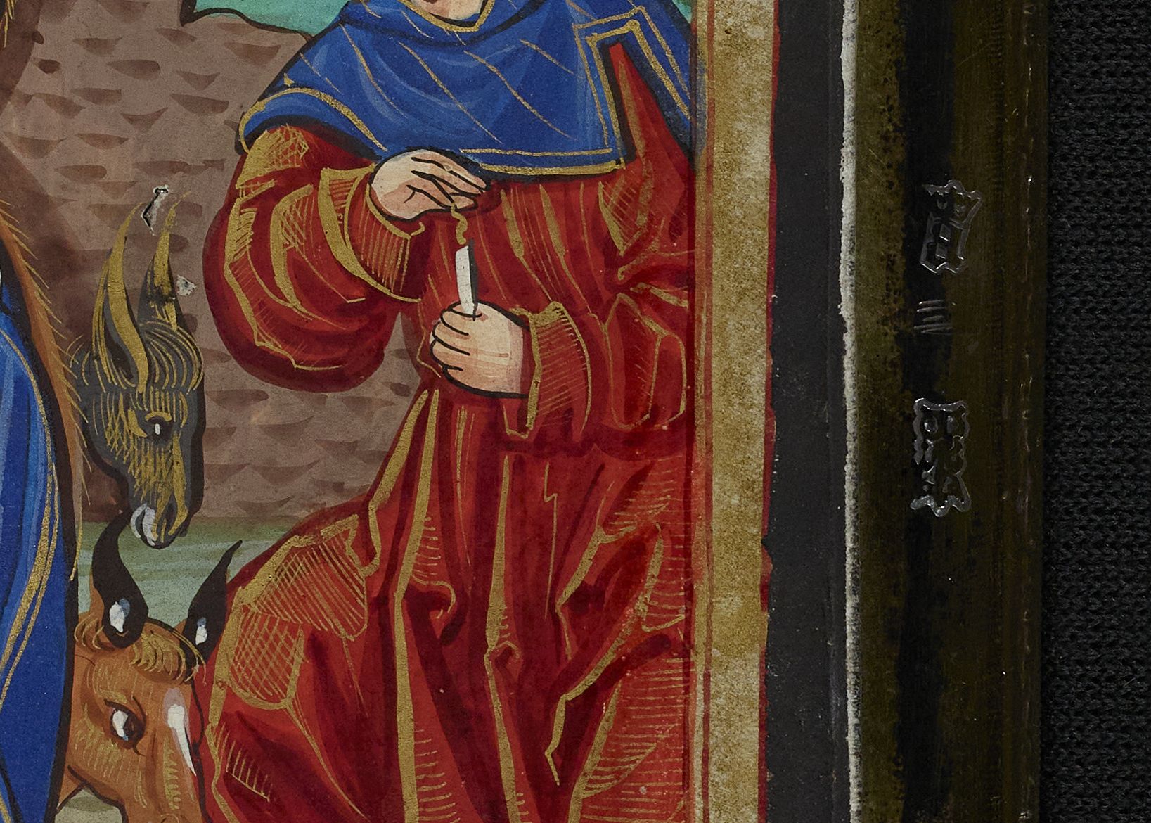 Details of the silver hallmarks in the binding of Thomas Cromwell's Book of Hours (C.30.9).